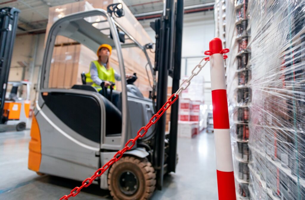 Safety at work with forklift in warehouse
